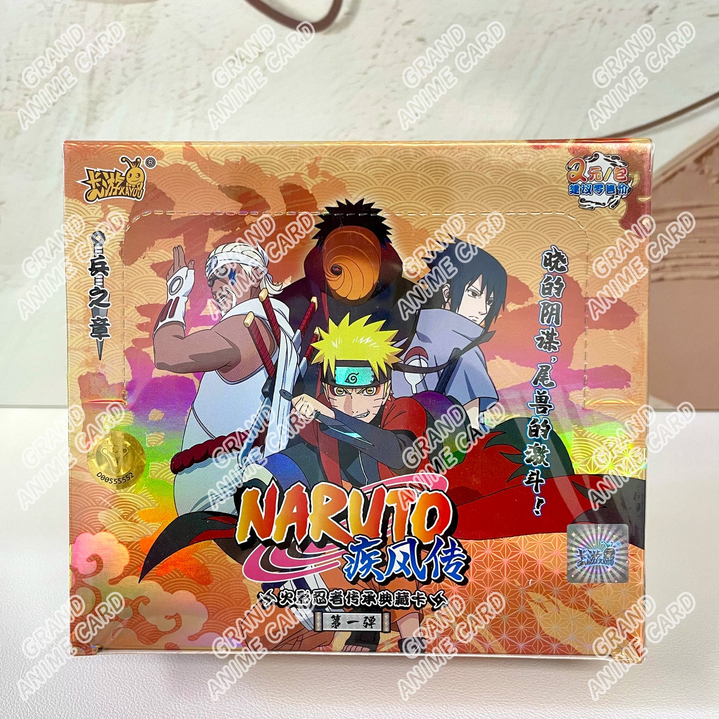 Scatola di carte Naruto KAYOU della collezione booster, con artwork delle carte Naruto, marchio Otaku Family Store Online.