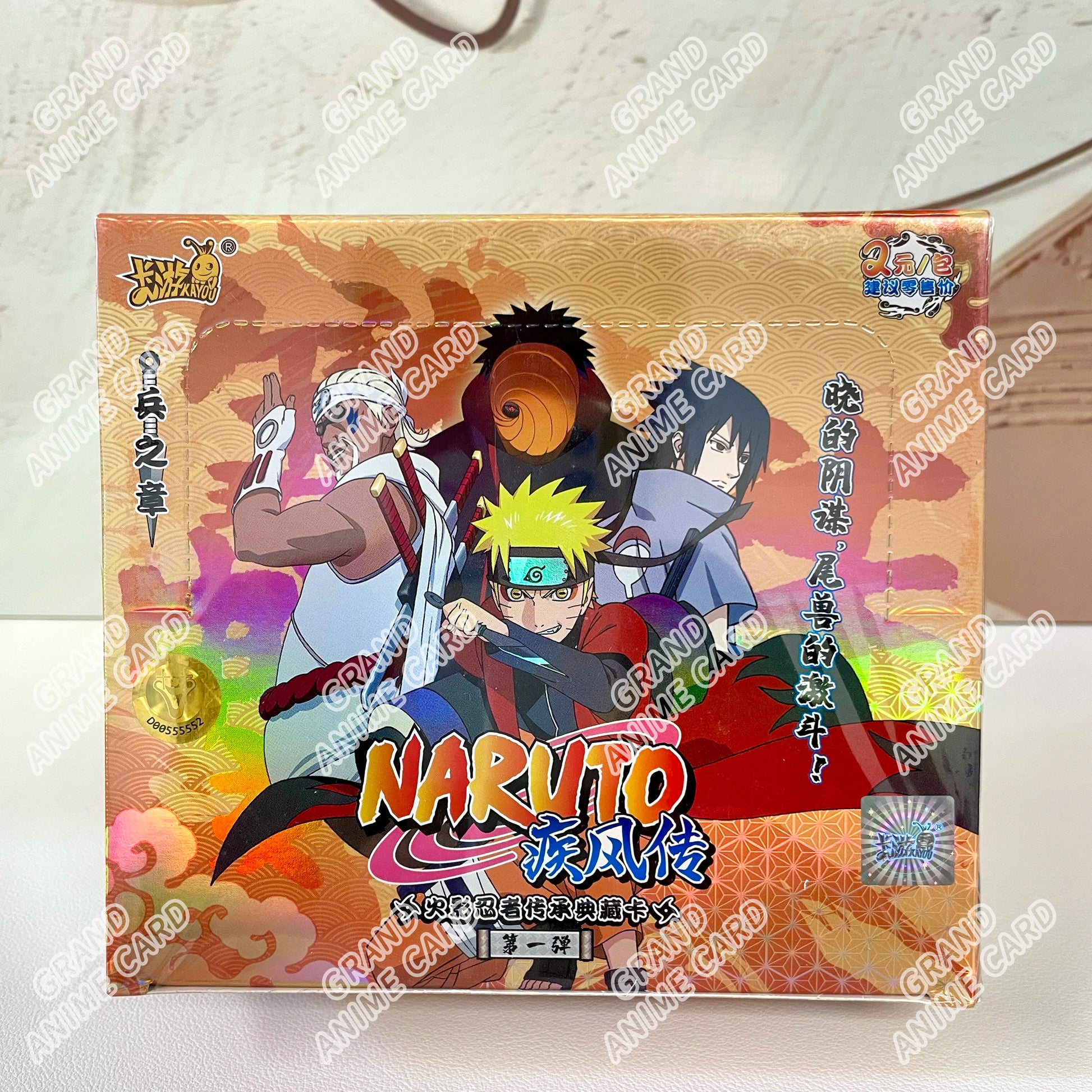 Scatola di carte Naruto KAYOU della collezione booster, con artwork delle carte Naruto, marchio Otaku Family Store Online.