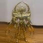 Figura d'azione JModel Saint Seiya Myth Cloth EX Virgo Shaka con dettagli dorati e armatura, posato con sfondo neutro.