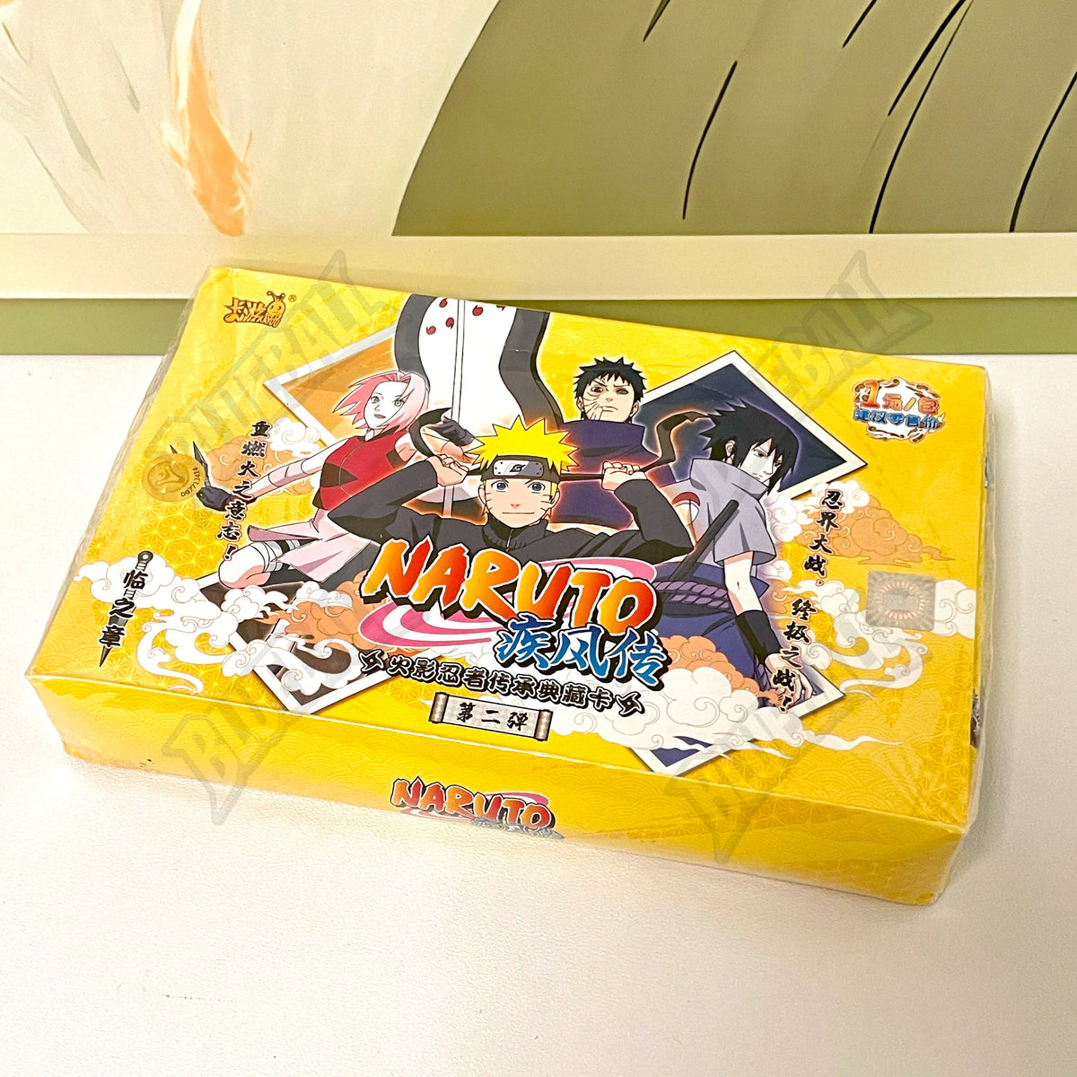 Carte da gioco Naruto TCG Chapter of the Ninja di Otaku Family Store, scatola aperta con carte rare e promo.