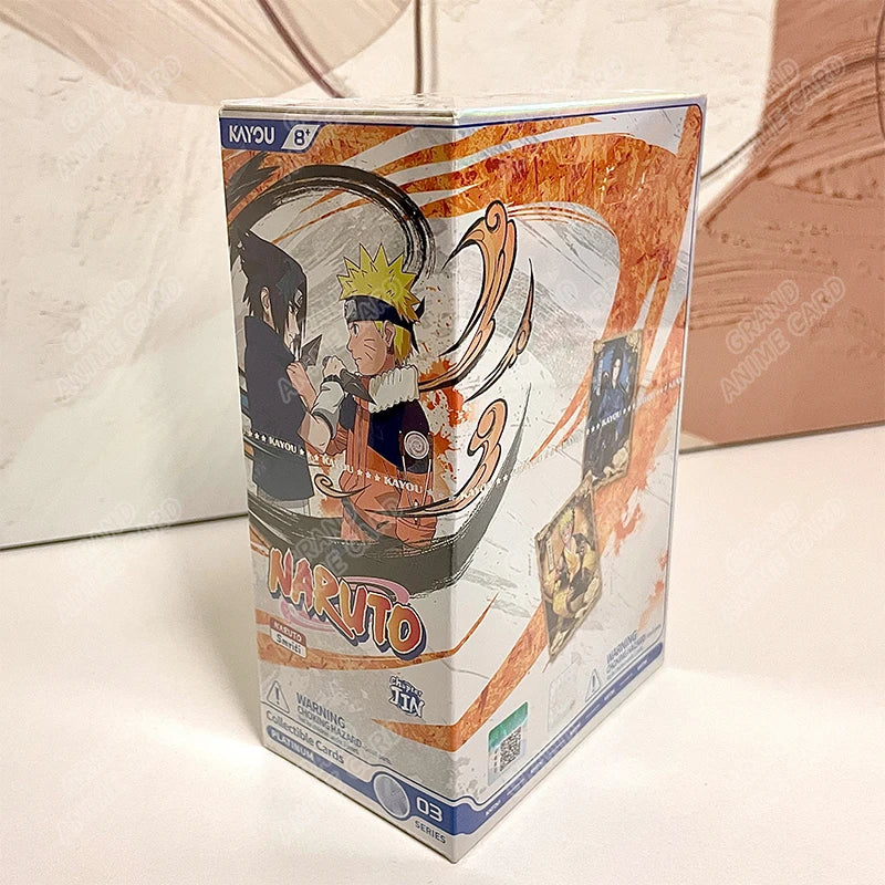 Scatola di carte da collezione Naruto KAYOU Booster Box, versione globale, con illustrazioni di personaggi Naruto e simboli ninja.